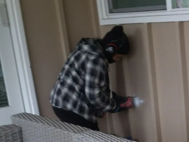Professional electrician installing an exterior outlet in Little Chute